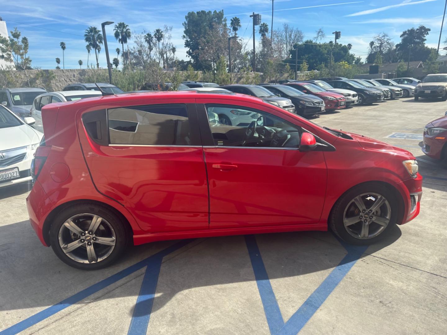 2013 Red /Black Chevrolet Sonic Cloth (1G1JG6SB3D4) with an 4 CYLINDER engine, Automatic transmission, located at 30 S. Berkeley Avenue, Pasadena, CA, 91107, (626) 248-7567, 34.145447, -118.109398 - The 2013 Chevrolet Sonic RS Auto 5-Door is a standout choice for drivers seeking a blend of style, performance, and practicality. At our Pasadena, CA dealership, we specialize in offering a wide array of used BHPH (Buy Here Pay Here) cars, including the dynamic Chevrolet Sonic RS. This detailed guid - Photo#4